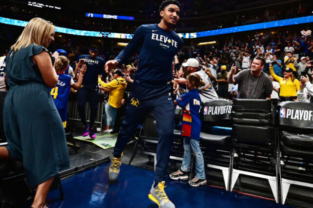 Denver Nuggets guard Gary Harris (14) runs onto the court for warm ups before the game against the Portland Trail Blazers in game seven of the second round of the 2019 NBA Playoffs at Pepsi Center.