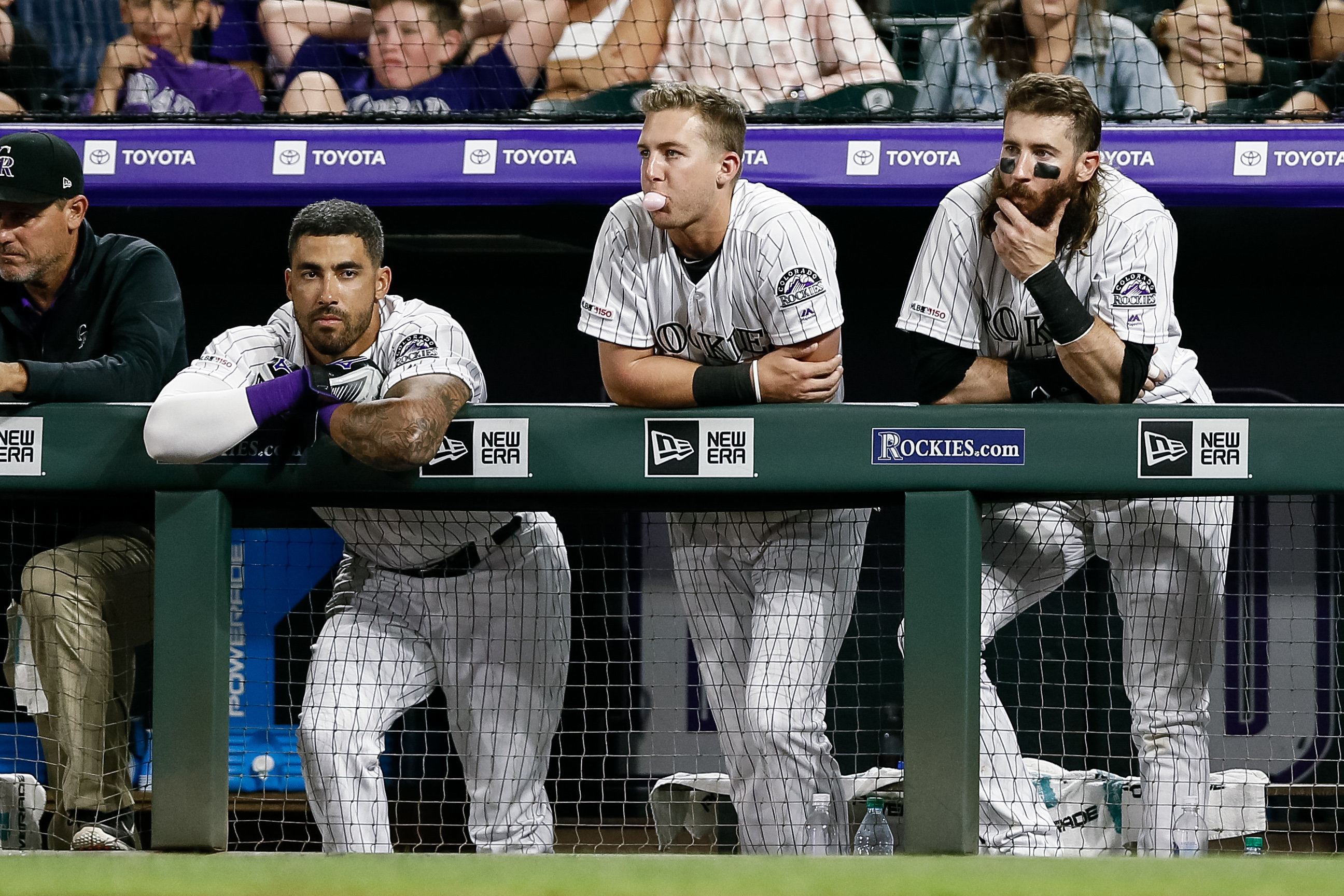 MLB: Game Two-San Francisco Giants at Colorado Rockies Colorado Rockies center fielder Ian Desmond (20) and second baseman Ryan McMahon (24) and right fielder Charlie Blackmon (19) look on from the dugout in the ninth inning against the San Francisco Giants at Coors Field.
