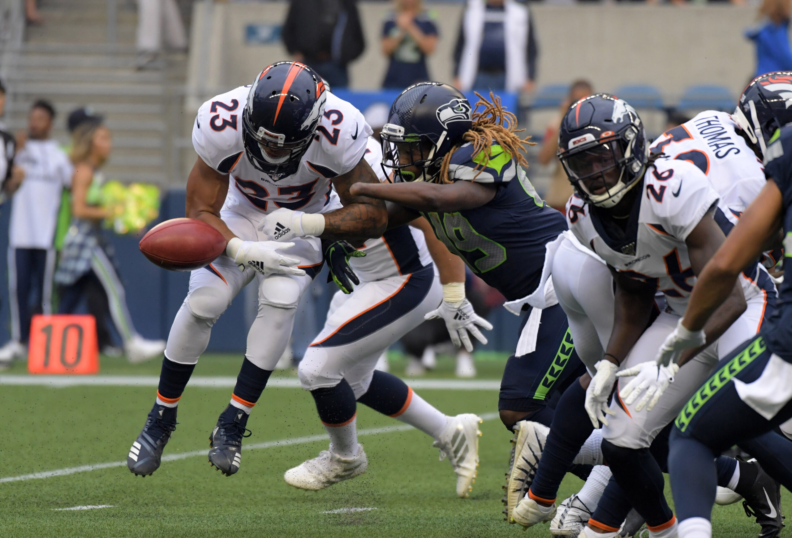 Denver Bronco's Malik Jackson throws ball into the stands scoring