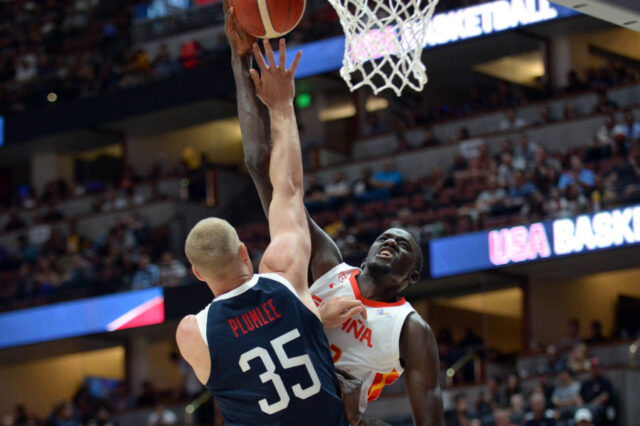 Spain center Ilimane Diop (12) moves to the basket against USA center Mason Plumlee (35) during the first half of an exhibition game at Honda Center.
