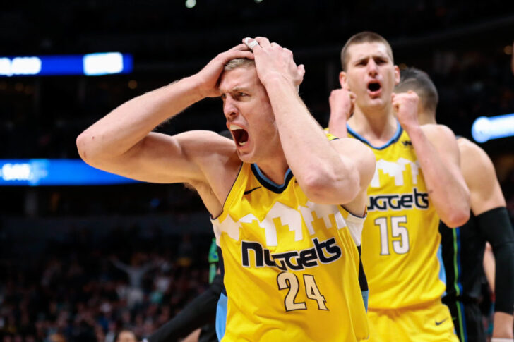 Denver Nuggets center Mason Plumlee (24) and center Nikola Jokic (15) react after a call in the fourth quarter against the Dallas Mavericks at the Pepsi Center.