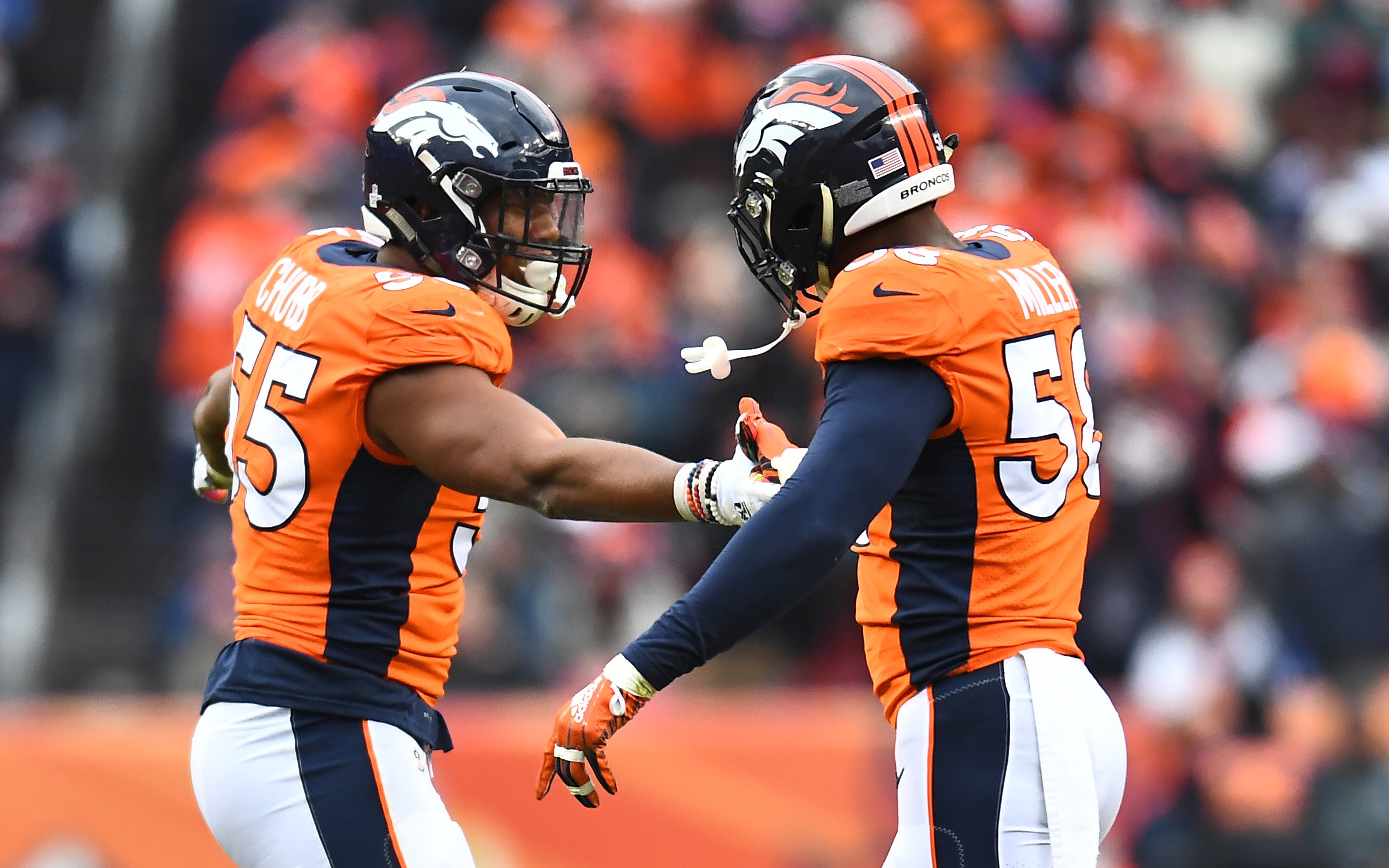 Von Miller and Bradley Chubb celebrate in 2018. Credit: Ron Chenoy, USA TODAY Sports.
