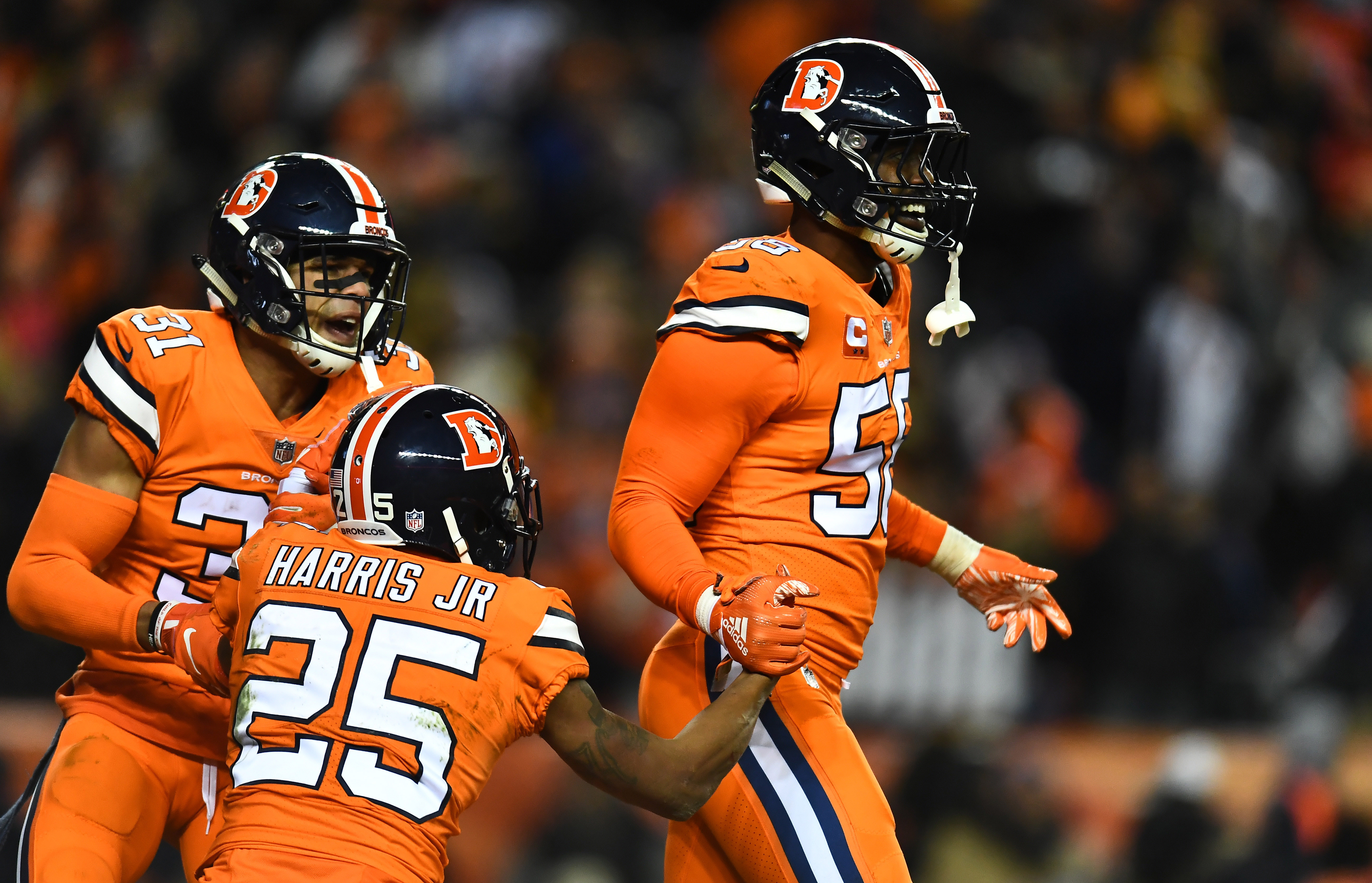 NFL: Pittsburgh Steelers at Denver Broncos Denver Broncos outside linebacker Von Miller (58) and inside linebacker Todd Davis (51) and cornerback Chris Harris (25) celebrate a turnover over in in the fourth quarter against the Pittsburgh Steelers at Broncos Stadium at Mile High.