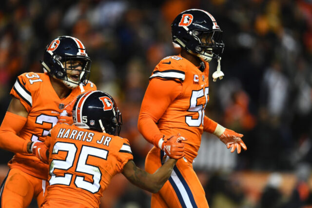Denver Broncos outside linebacker Von Miller (58) and inside linebacker Todd Davis (51) and cornerback Chris Harris (25) celebrate a turnover over in in the fourth quarter against the Pittsburgh Steelers at Broncos Stadium at Mile High.