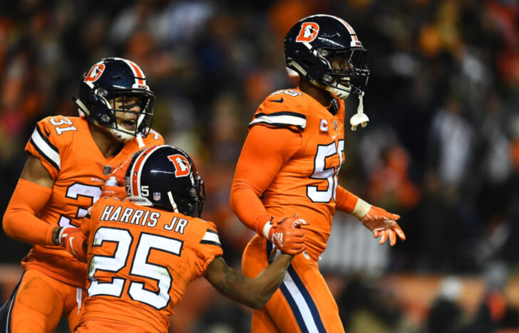 Denver Broncos outside linebacker Von Miller (58) and inside linebacker Todd Davis (51) and cornerback Chris Harris (25) celebrate a turnover over in in the fourth quarter against the Pittsburgh Steelers at Broncos Stadium at Mile High.
