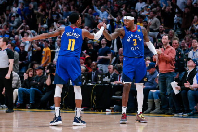 Denver Nuggets forward Torrey Craig (3) celebrates with guard Monte Morris (11) after a play in the third quarter against the Houston Rockets at the Pepsi Center.