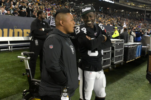 Oakland Raiders wide receiver Antonio Brown (84) talks with Marcus Padilla in the second half against the Green Bay Packers at Investors Group Field. The Raiders defeated the Packers 22-21.