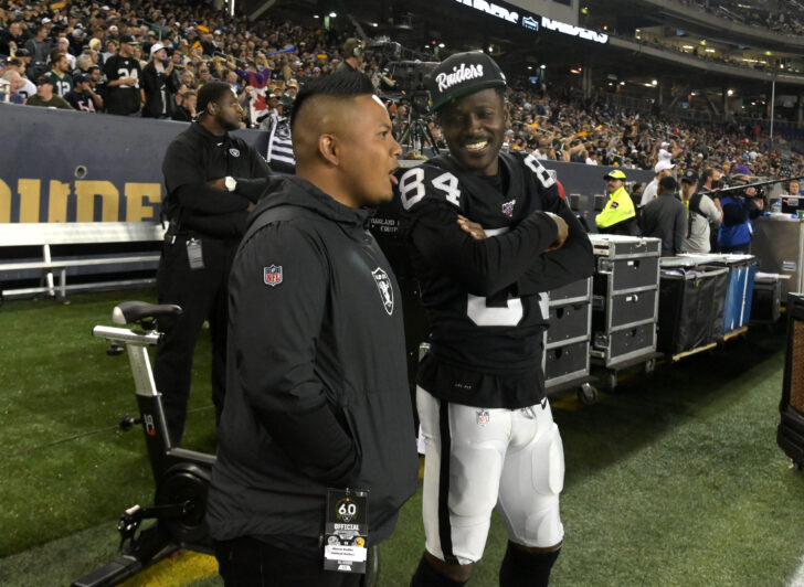 Oakland Raiders wide receiver Antonio Brown (84) talks with Marcus Padilla in the second half against the Green Bay Packers at Investors Group Field. The Raiders defeated the Packers 22-21.