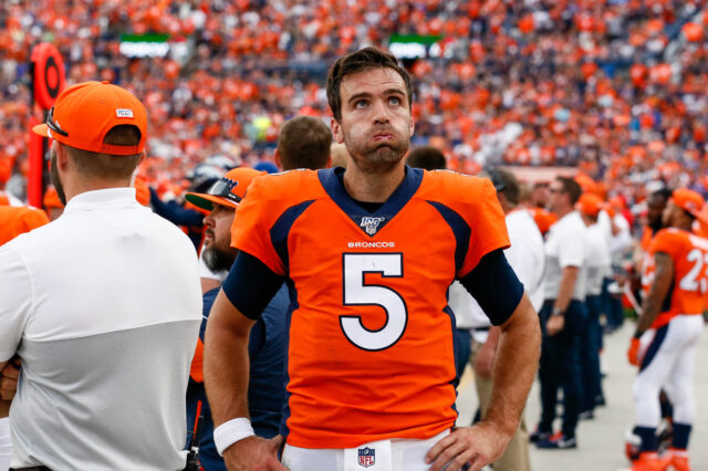 Denver Broncos quarterback Joe Flacco (5) reacts on the sidelines in the fourth quarter against the Chicago Bears at Empower Field at Mile High.