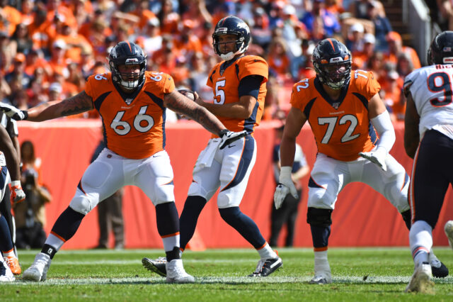 Denver Broncos offensive tackle Dalton Risner (66) and offensive tackle Garett Bolles (72) block for quarterback Joe Flacco (5) in the fourth quarter against the Chicago Bears at Empower Field at Mile High.
