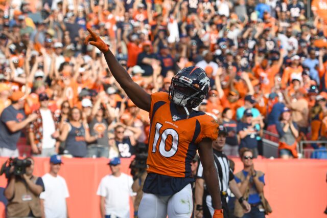 Denver Broncos wide receiver Emmanuel Sanders (10) celebrates his touchdown in the fourth quarter against the Chicago Bears at Empower Field at Mile High.