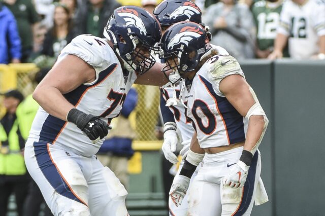 Bolles and Phillip Lindsay celebrate. Credit: Benny Sieu, USA TODAY Sports.