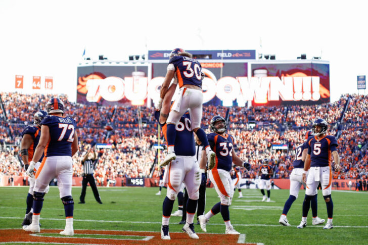 Denver Broncos guard Connor McGovern (60) celebrates the touchdown of running back Phillip Lindsay (30) in the third quarter against the Tennessee Titans at Empower Field at Mile High.