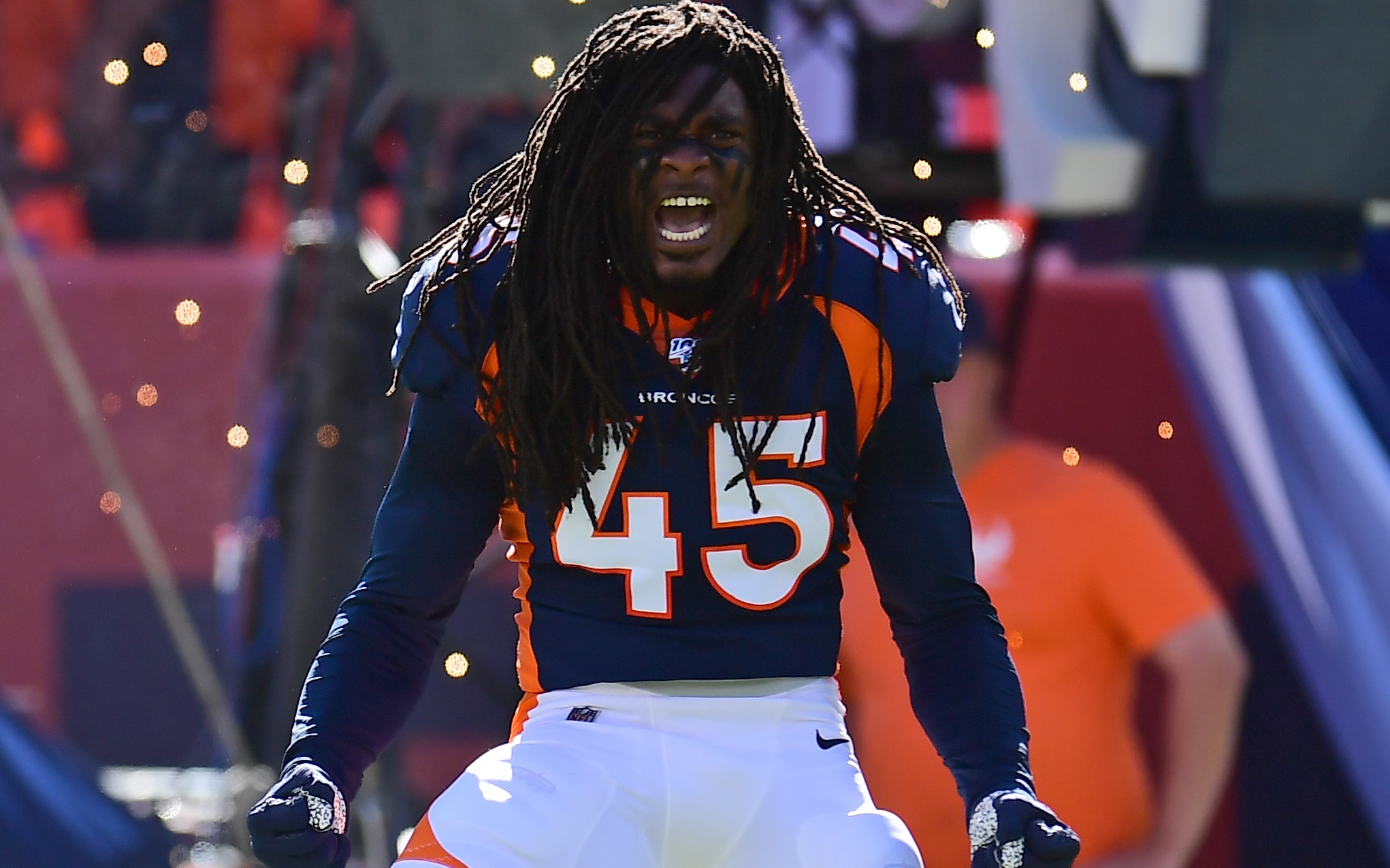 Alexander "Dino" Johnson roars before the Broncos - Titans game last week. Credit: Ron Chenoy, USA TODAY Sports.