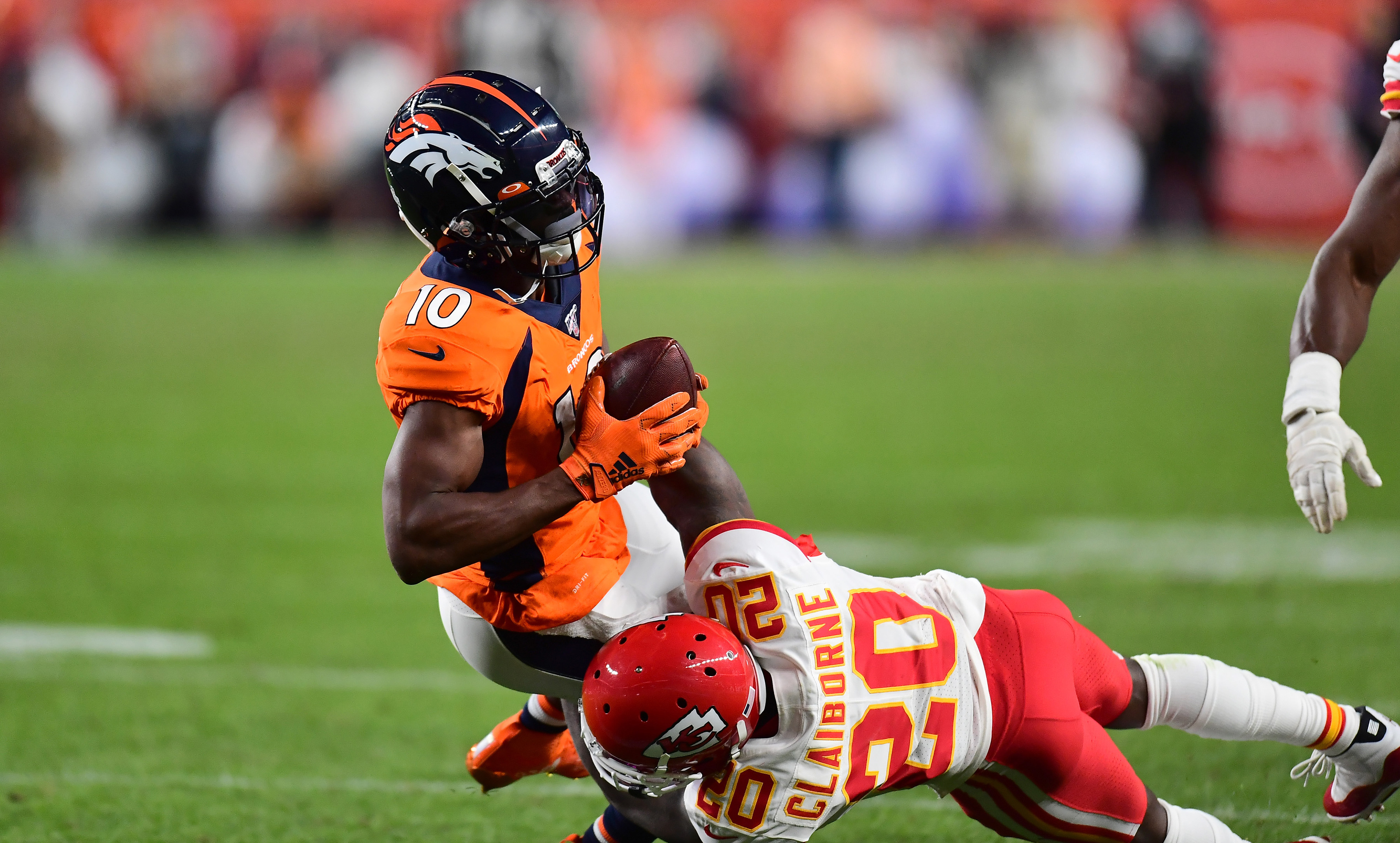 NFL: Kansas City Chiefs at Denver Broncos Kansas City Chiefs cornerback Morris Claiborne (20) tackles Denver Broncos wide receiver Emmanuel Sanders (10) in the second quarter at Empower Field at Mile High.