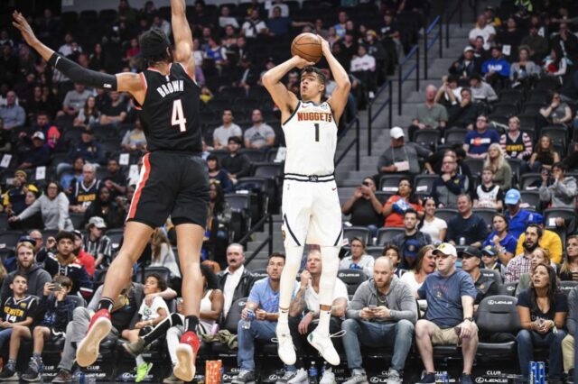 Denver Nuggets forward Michael Porter Jr. (1) lines up a shot over Portland Trail Blazers center Moses Brown (4) during the second half at Pepsi Center.