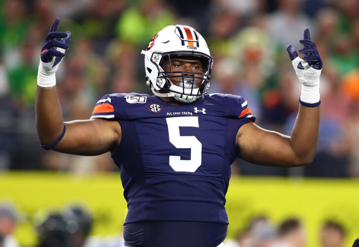 Auburn Tigers defensive tackle Derrick Brown (5) raises his arms during the game against the Oregon Ducks at AT&T Stadium.