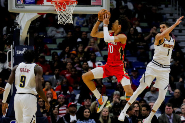 New Orleans Pelicans center Jaxson Hayes (10) shoots over Denver Nuggets forward Michael Porter Jr. (1) during the first quarter at the Smoothie King Center