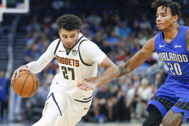 Denver Nuggets guard Jamal Murray (27) drives around Orlando Magic guard Markelle Fultz (20) during the second half at Amway Center