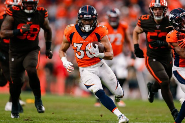 Denver Broncos running back Phillip Lindsay (30) runs for a touchdown in the third quarter against the Cleveland Browns at Empower Field at Mile High.