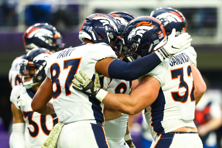 Denver Broncos tight end Noah Fant (87) celebrates with fullback Andy Janovich (32) after Janovich scored a touchdown in the first quarter against the Minnesota Vikings at U.S. Bank Stadium.