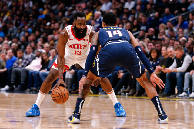 Houston Rockets guard James Harden (13) controls the ball as Denver Nuggets guard Gary Harris (14) guards in the third quarter at the Pepsi Center.