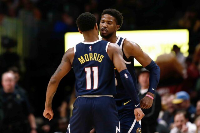 Denver Nuggets guard Malik Beasley (25) celebrates with guard Monte Morris (11) after a play in the fourth quarter against the Phoenix Suns at the Pepsi Center.