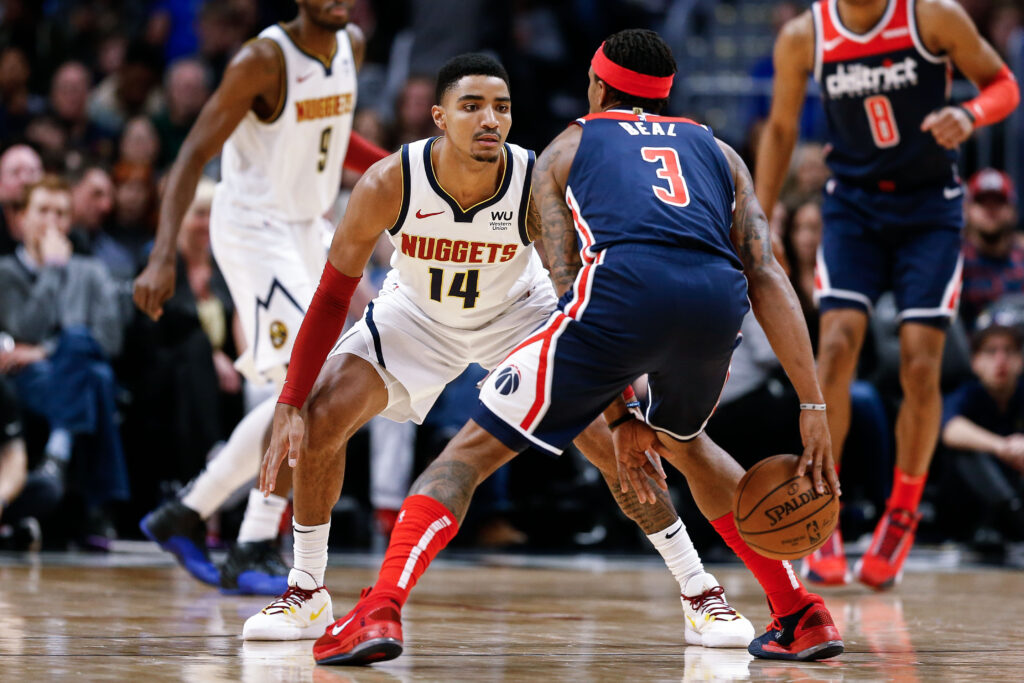 Washington Wizards guard Bradley Beal (3) controls the ball as Denver Nuggets guard Gary Harris (14) guards in the second quarter at the Pepsi Center.