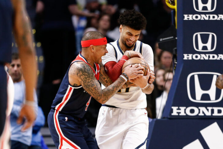 Denver Nuggets guard Jamal Murray (27) and Washington Wizards guard Isaiah Thomas (4) battle for the ball in the second quarter at the Pepsi Center.