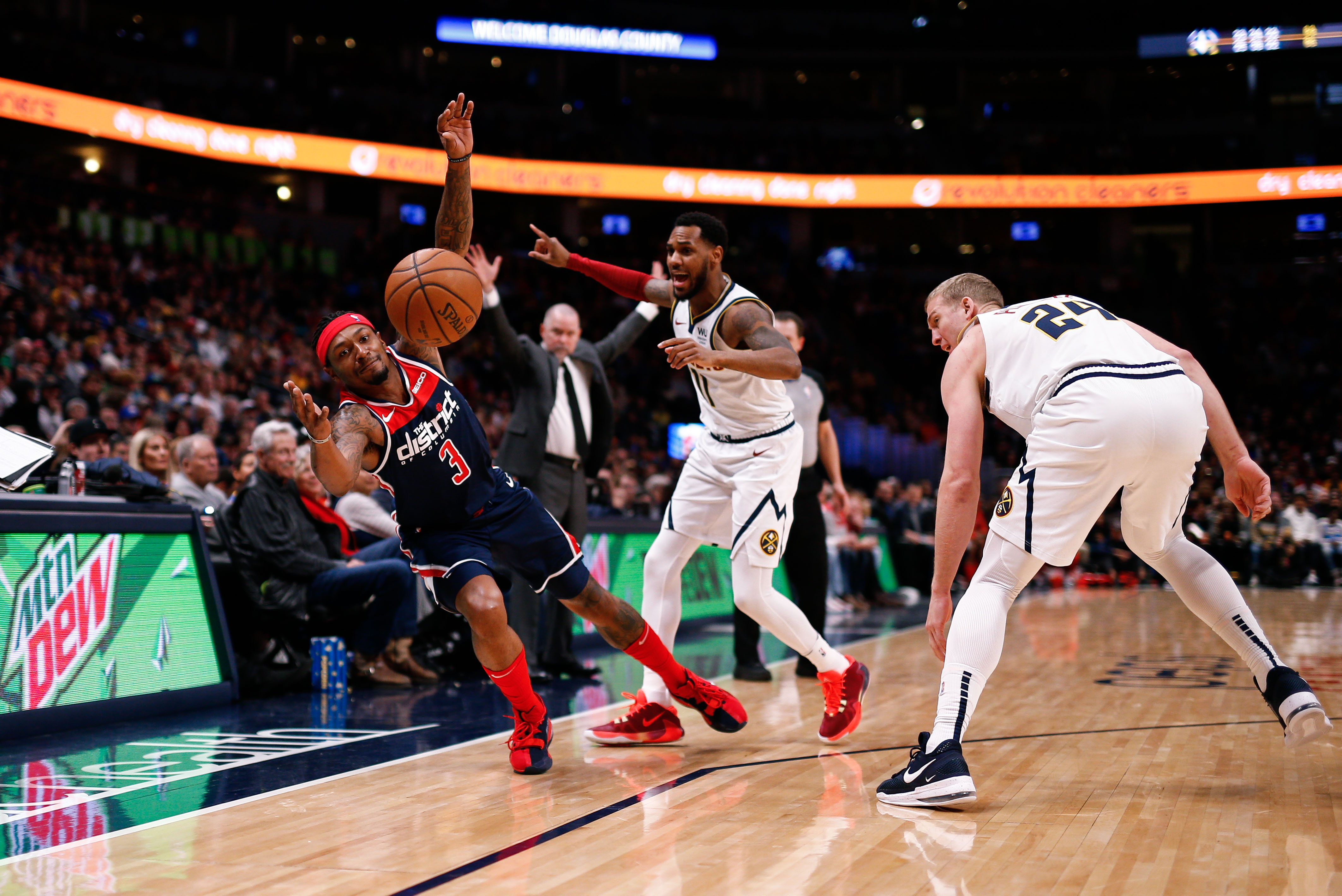 NBA: Washington Wizards at Denver Nuggets Washington Wizards guard Bradley Beal (3) reaches for a loose ball on a play with Denver Nuggets guard Monte Morris (11) and forward Mason Plumlee (24) in the third quarter at the Pepsi Center.