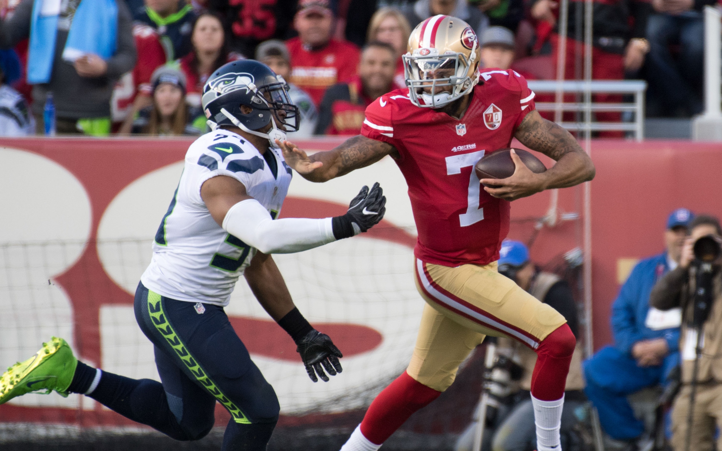 USATSI_9823067 Cropped Colin Kaepernick stiff-arms Bobby Wagner in Jan. 2017. Credit: Kyle Terada, USA TODAY Sports.