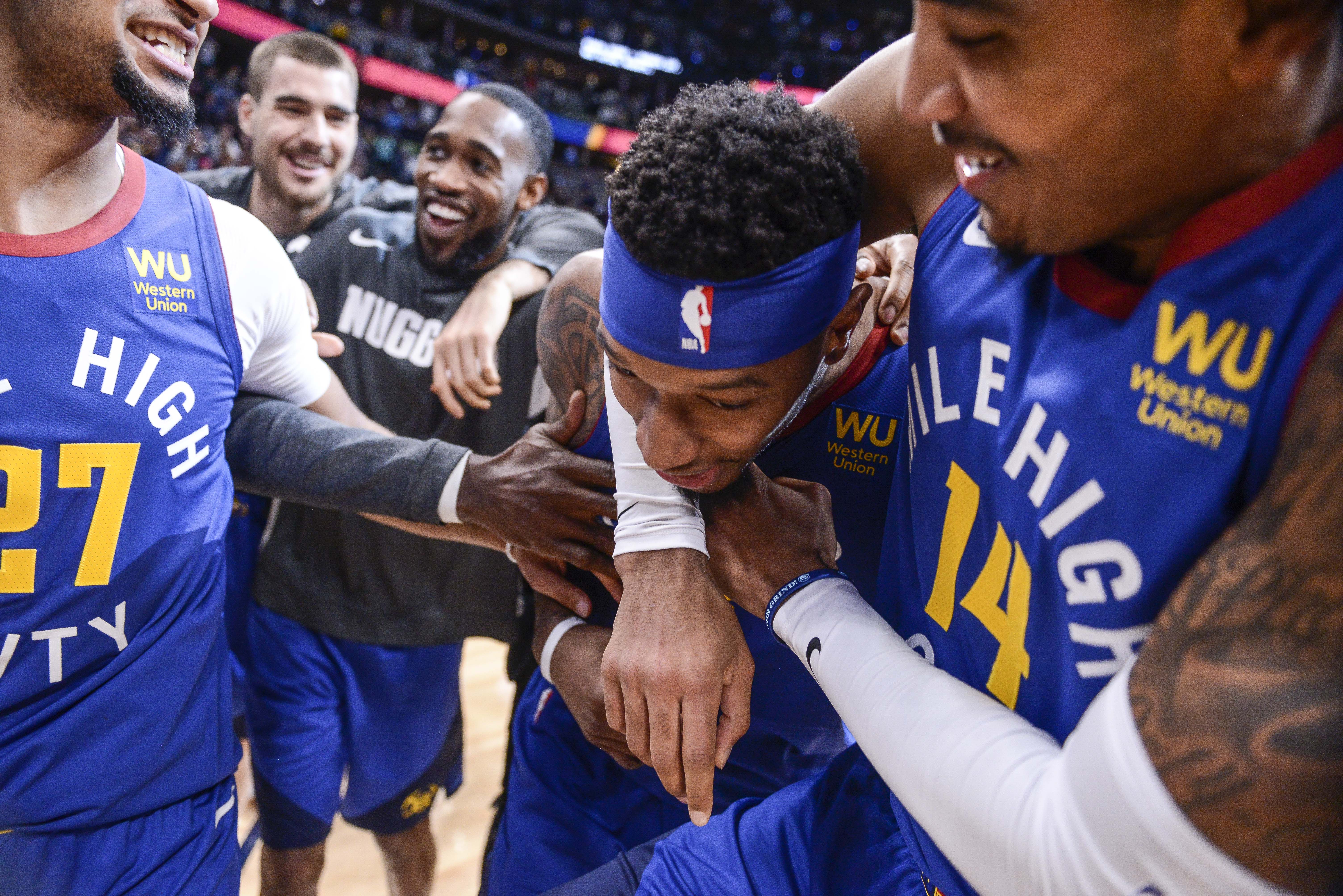 NBA: Phoenix Suns at Denver Nuggets Denver Nuggets guard Gary Harris (14) hugs forward Torrey Craig (3), who blocked a shot to win the game against the Phoenix Suns in overtime at Pepsi Center.