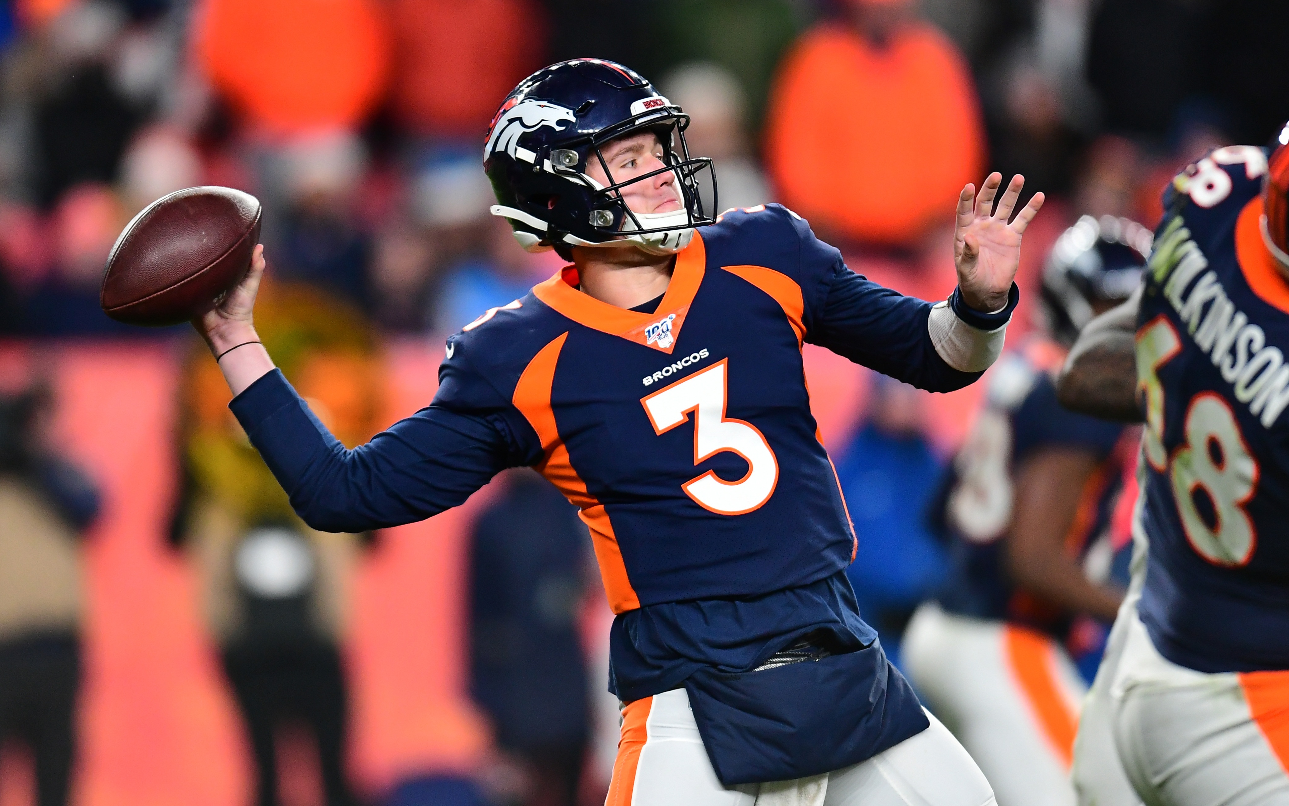 USATSI_13739021 Cropped Drew Lock throws deep to Courtland Sutton with eight seconds to play. Credit: Ron Chenoy, USA TODAY Sports.