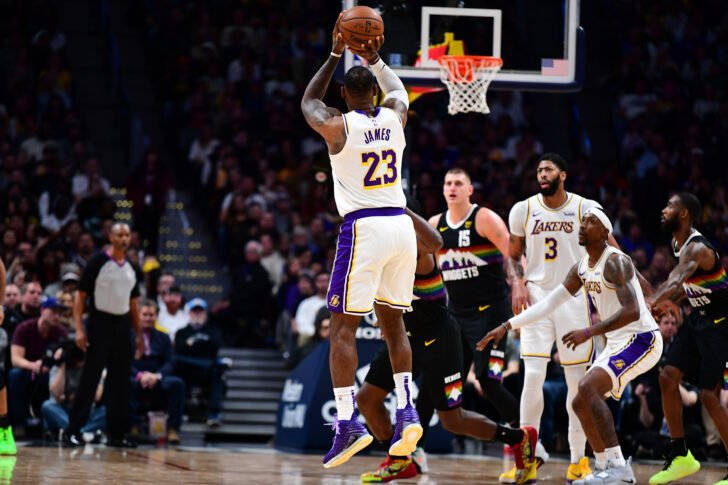 Los Angeles Lakers forward LeBron James (23) shoots a jump shot in the second quarter against the Denver Nuggets at the Pepsi Center.