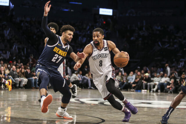 Brooklyn Nets guard Spencer Dinwiddie (8) looks to drive past Denver Nuggets guard Jamal Murray (27) in the fourth quarter at Barclays Center.
