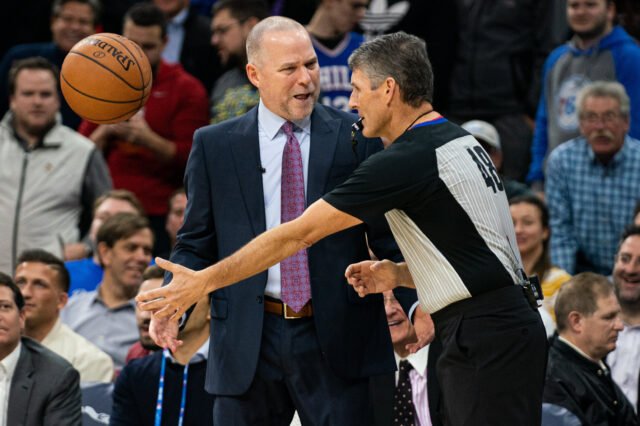 Denver Nuggets head coach Michael Malone reacts with referee Scott Foster (48) after being called for a technical foul during the second quarter against the Philadelphia 76ers at Wells Fargo Center.