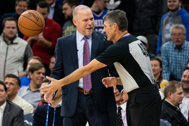 Denver Nuggets head coach Michael Malone reacts with referee Scott Foster (48) after being called for a technical foul during the second quarter against the Philadelphia 76ers at Wells Fargo Center.