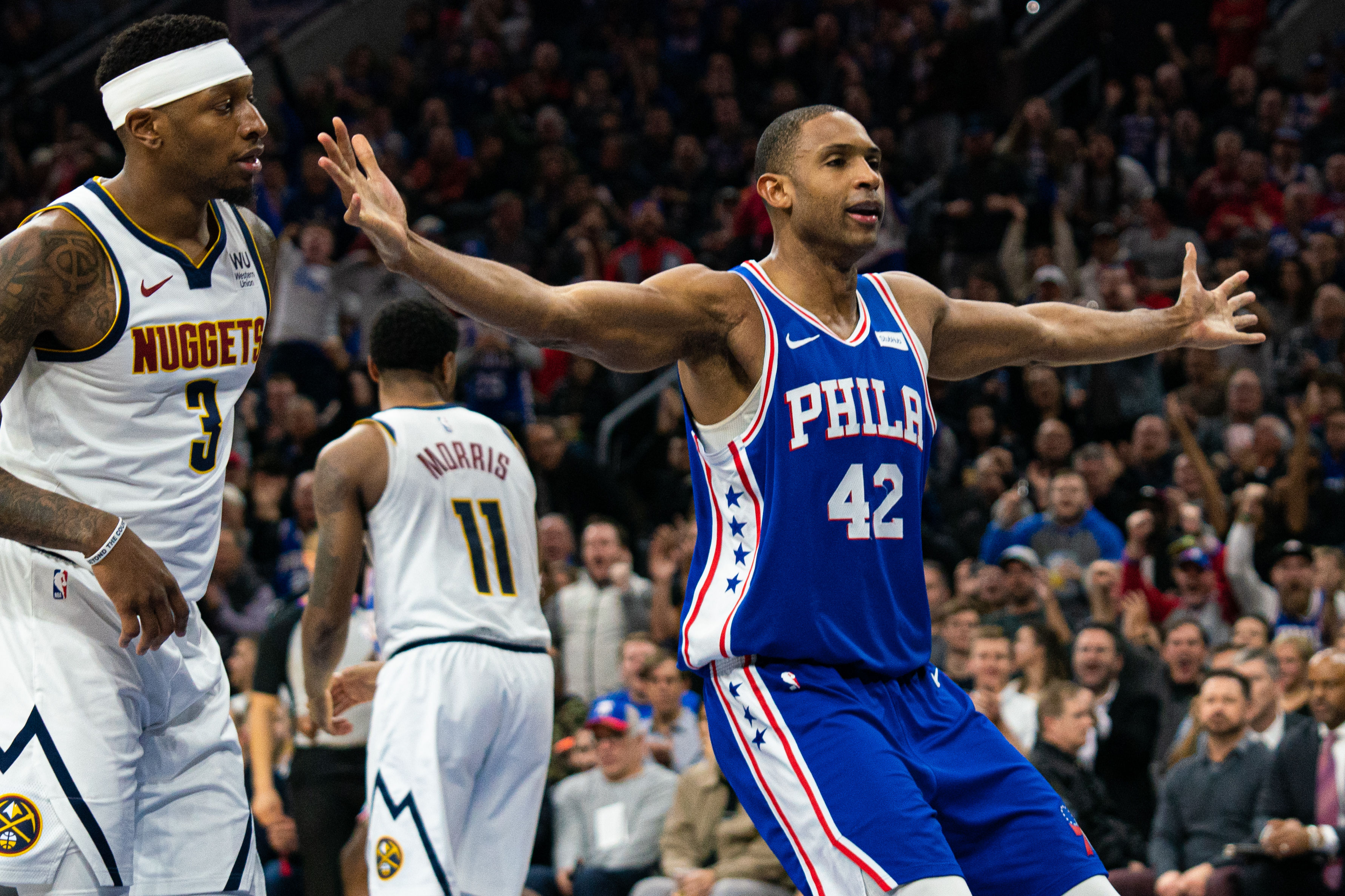 NBA: Denver Nuggets at Philadelphia 76ers Philadelphia 76ers center Al Horford (42) reacts in front of Denver Nuggets forward Torrey Craig (3) after dunking the ball during the third quarter at Wells Fargo Center.