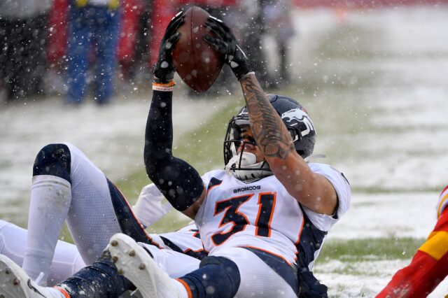 Justin Simmons' incredible interception against Kansas City in the snow last week. Credit: Denny Medley, USA TODAY Sports.