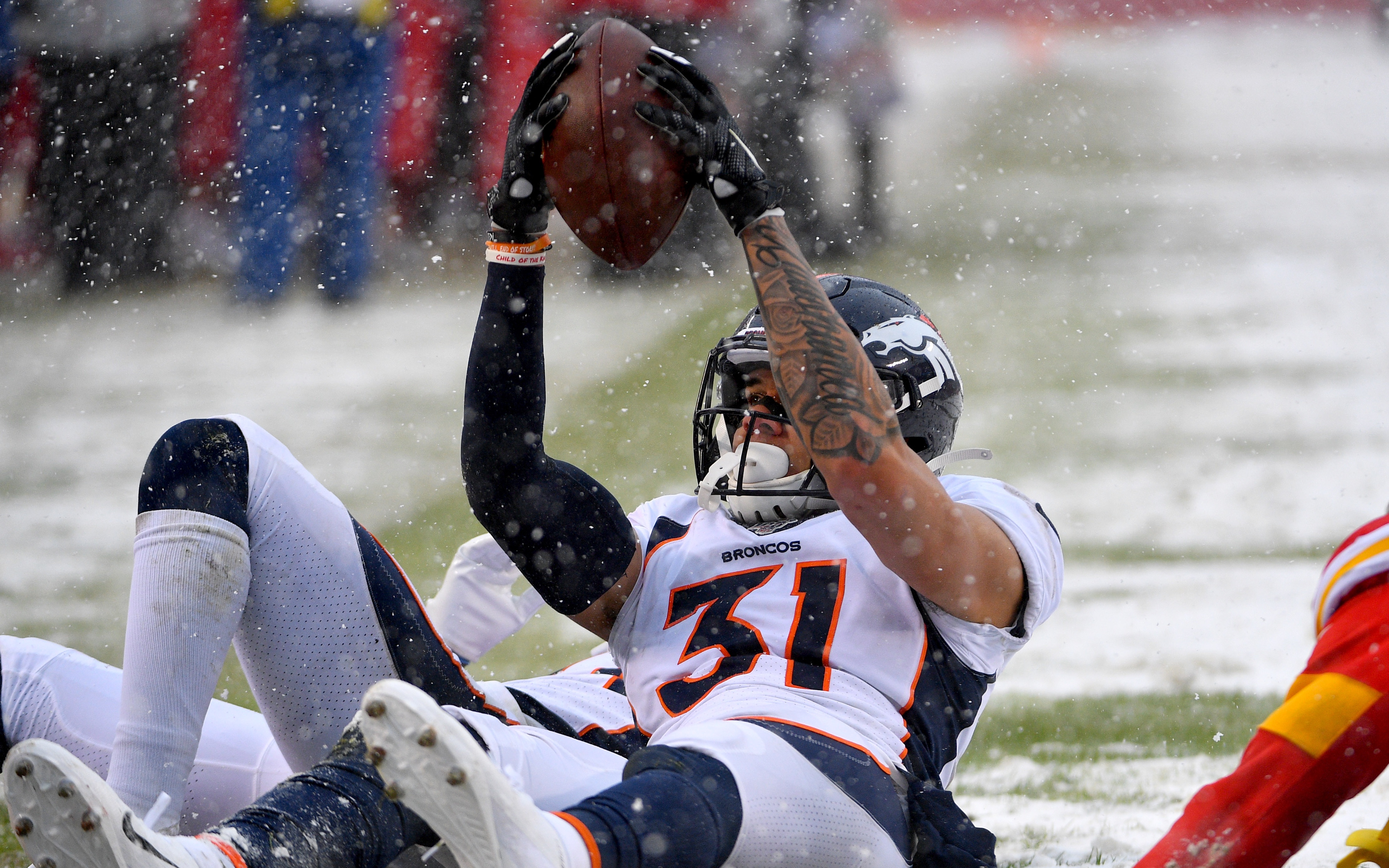 Justin Simmons' incredible interception against Kansas City in the snow last week. Credit: Denny Medley, USA TODAY Sports.