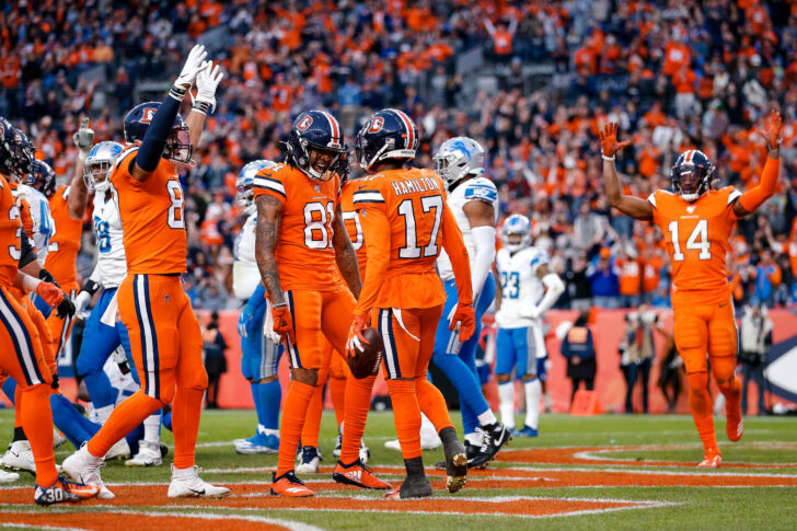 Denver Broncos wide receiver DaeSean Hamilton (17) celebrates with wide receiver Tim Patrick (81) and tight end Noah Fant (87) after scoring a touchdown against the Detroit Lions in the fourth quarter at Empower Field at Mile High.
