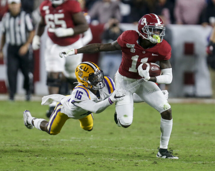 LSU Tigers cornerback Jay Ward (16) tries to bring down Alabama Crimson Tide wide receiver Henry Ruggs III (11) after a reception during the second half of an NCAA college football game at Bryant-Denny Stadium