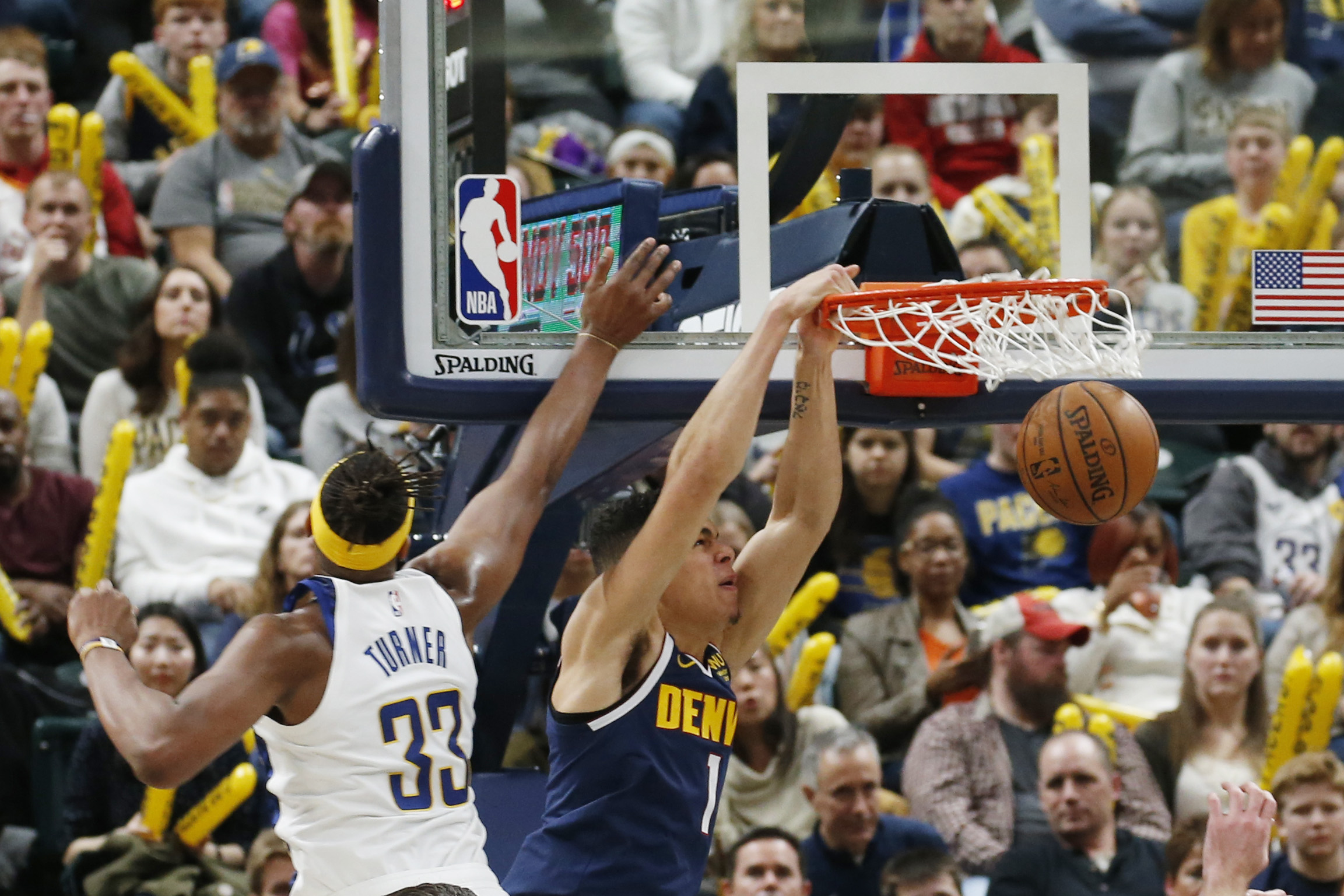 NBA: Denver Nuggets at Indiana Pacers Denver Nuggets forward Michael Porter Jr. (1) dunks the ball against Indiana Pacers center Myles Turner (33) during the third quarter at Bankers Life Fieldhouse.