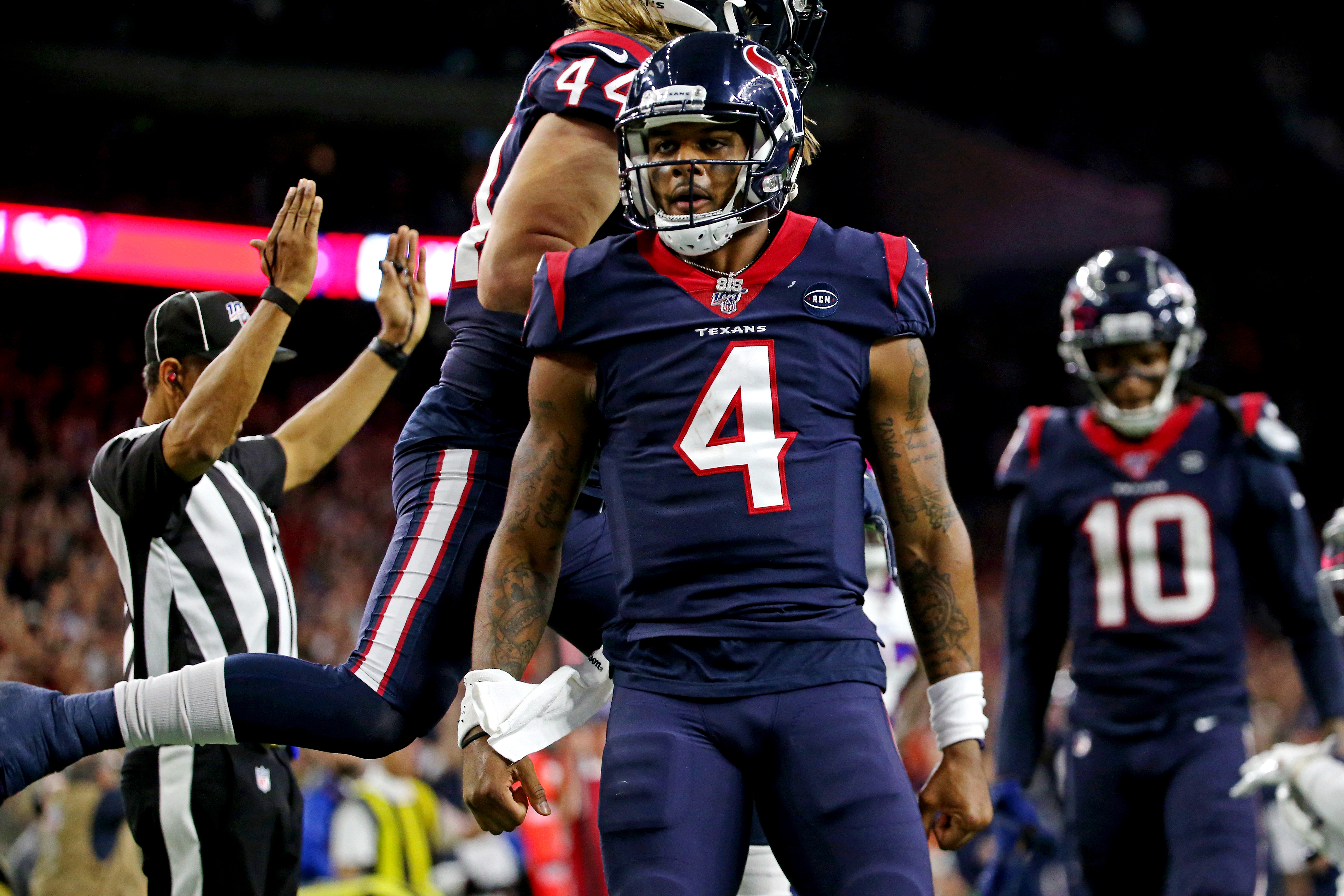 Houston Texans quarterback Deshaun Watson (4) celebrate after scoring a touchdown during the third quarter against the Buffalo Bills in the AFC Wild Card NFL Playoff game at NRG Stadium.