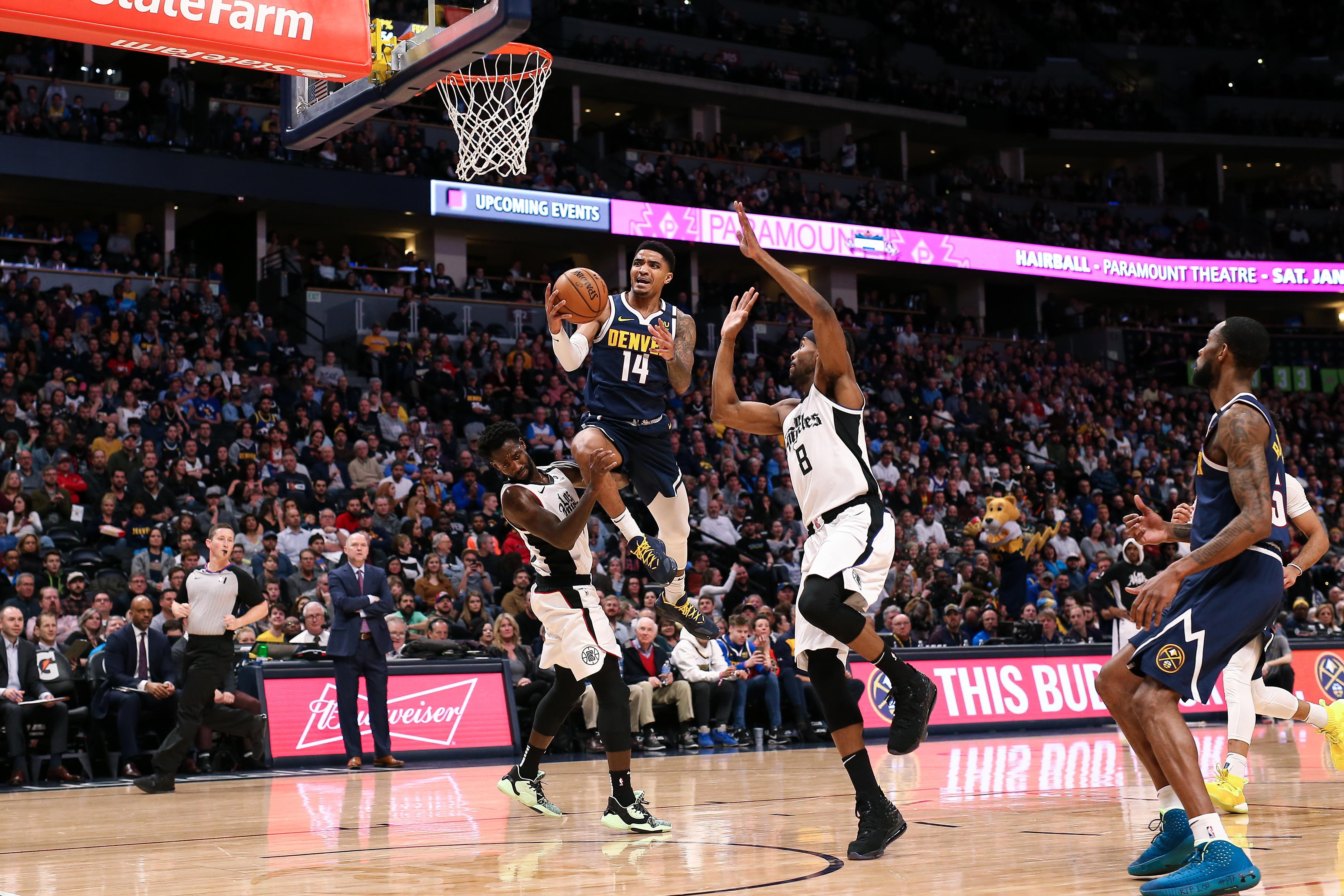 NBA: Los Angeles Clippers at Denver Nuggets Denver Nuggets guard Gary Harris (14) drives to the net against Los Angeles Clippers guard Patrick Beverley (21) and forward Maurice Harkless (8) in the second quarter at the Pepsi Center.