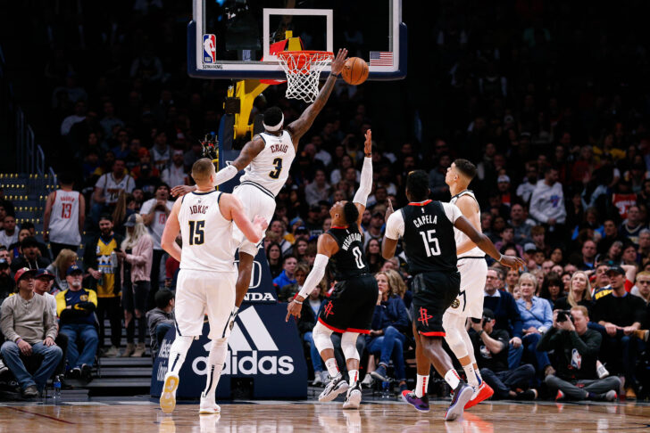 Denver Nuggets forward Torrey Craig (3) blocks the shot of Houston Rockets guard Russell Westbrook (0) as center Nikola Jokic (15) and center Clint Capela (15) and forward Michael Porter Jr. (1) watch in the second quarter at the Pepsi Center.