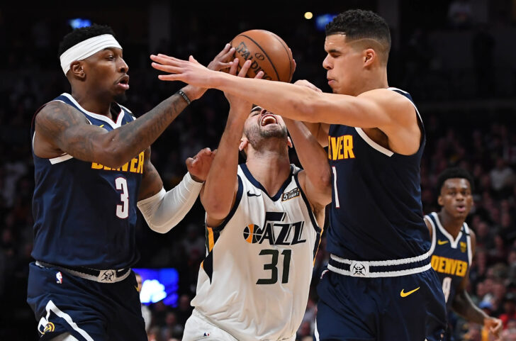 Nuggets forward Michael Porter Jr. (1) and forward Torrey Craig (3) collide into Utah Jazz forward Georges Niang (31) in the second quarter at the Pepsi Center.