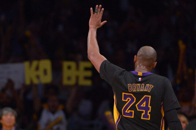 Los Angeles Lakers forward Kobe Bryant (24) waves to fans in the stands after leaving the game against the Denver Nuggets at Staples Center. The Nuggets won 116-105.