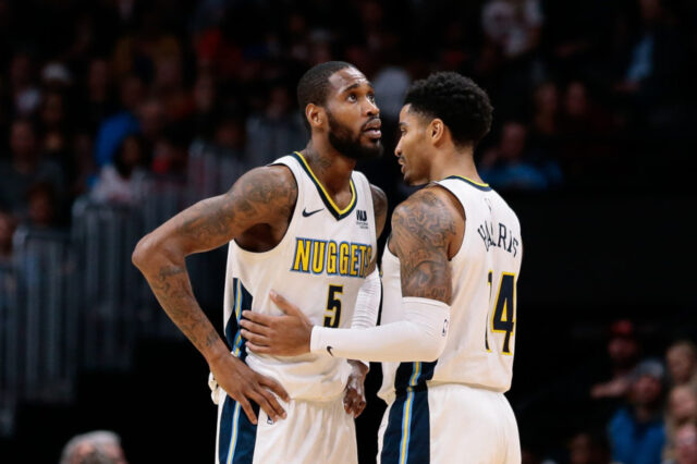 Denver Nuggets guard Will Barton (5) talks with guard Gary Harris (14) in the third quarter against the Chicago Bulls at the Pepsi Center.