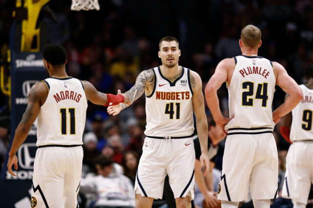 Denver Nuggets forward Juancho Hernangomez (41) reacts with guard Monte Morris (11) and forward Mason Plumlee (24) after a play in the fourth quarter against the Washington Wizards at the Pepsi Center.
